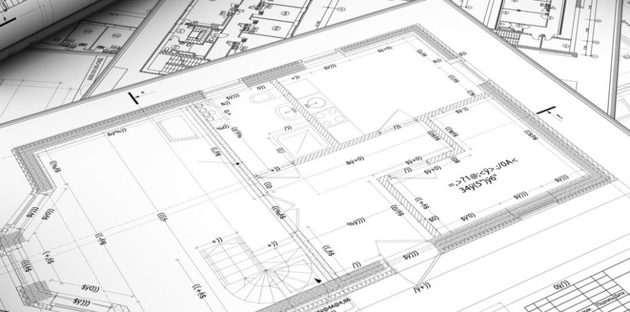 A stack of blueprints for a new building design