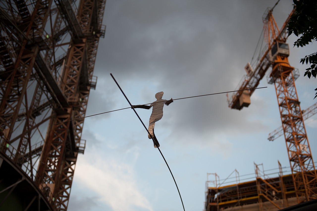 silhouetted figure on a tightrope