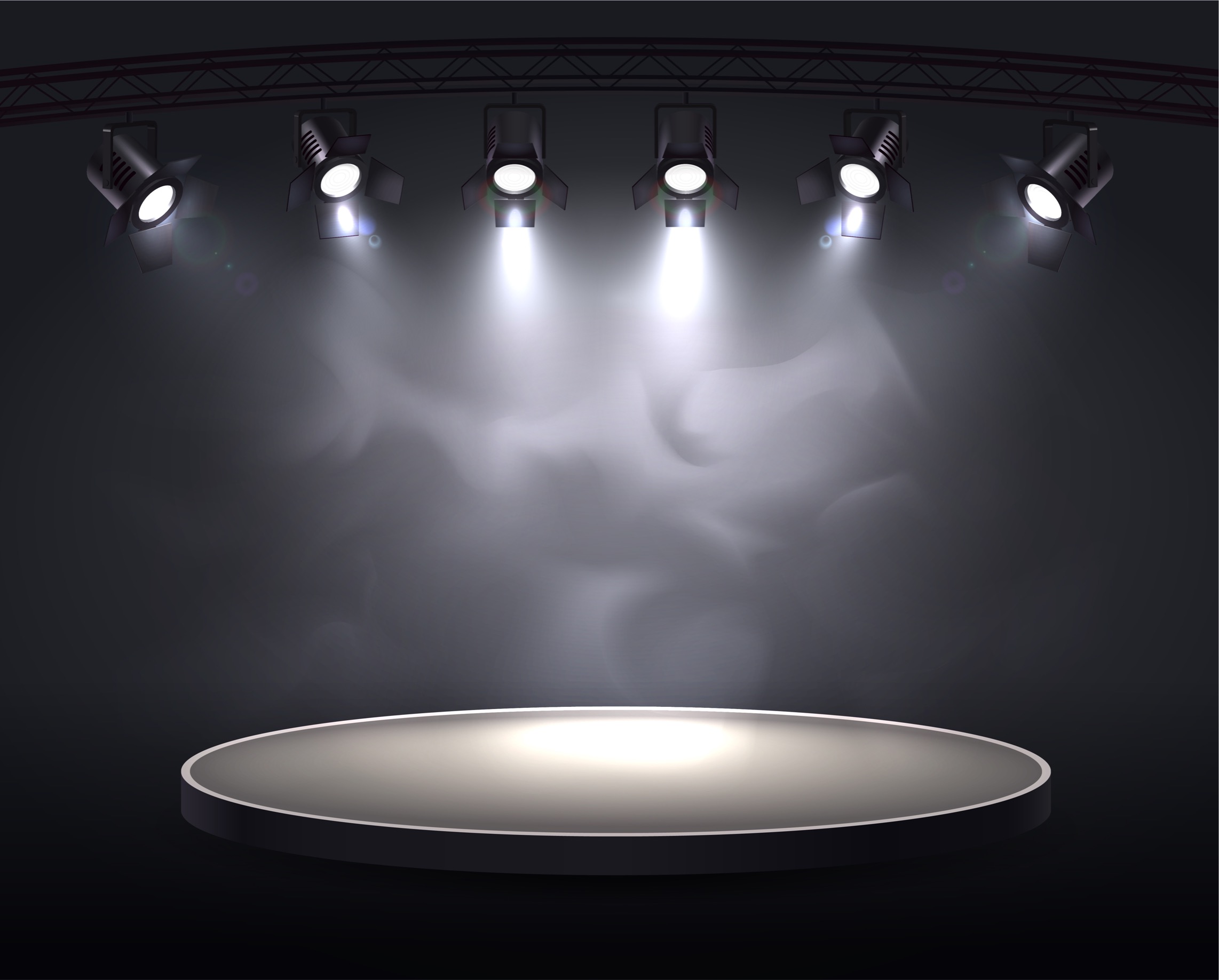 Spotlights highlight a round stage
